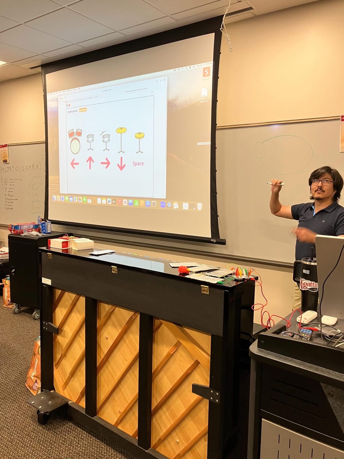 An instructor demoing a Scratch project to students