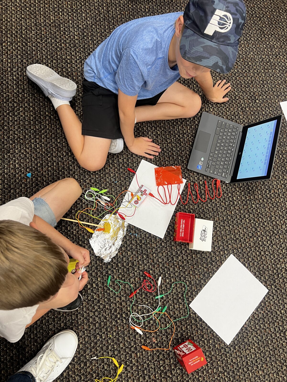 Students building a custom instrument with a MakeyMakey kit