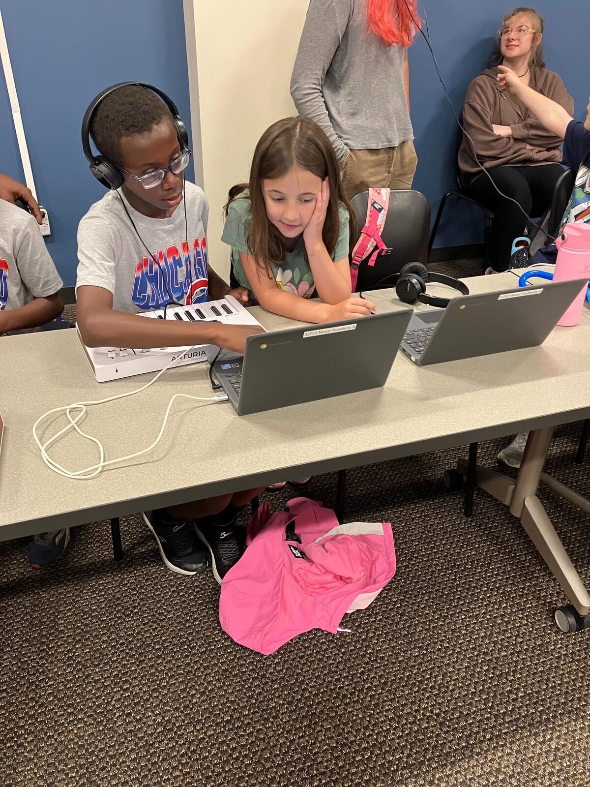 Two students producing music together